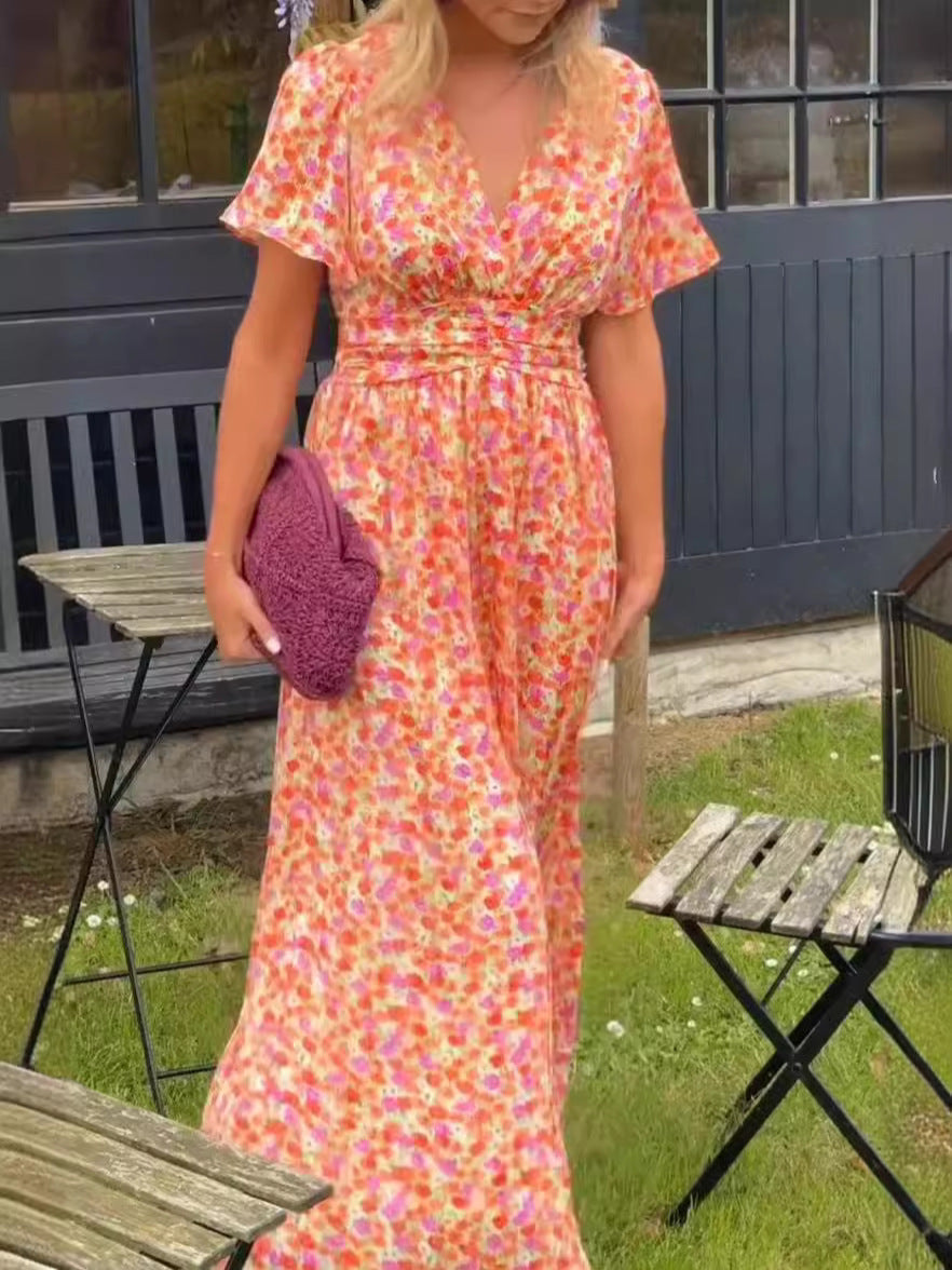 Nova | Lång blommig klänning med flödande fall